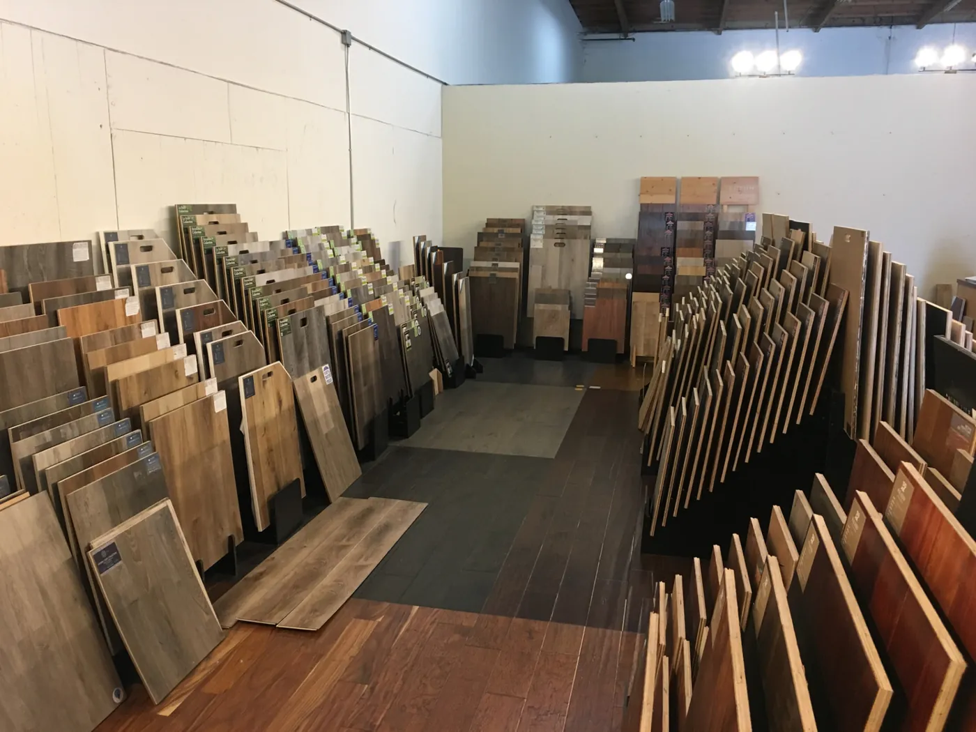 Aisles of flooring samples at Wholesale Woodfloor Warehouse